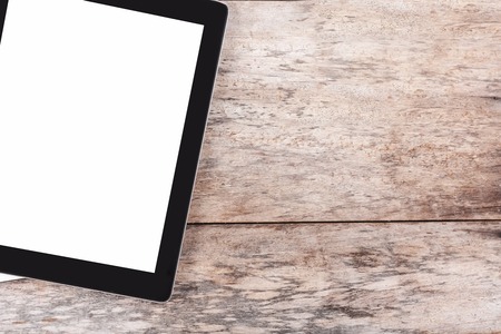 Tablet on a wooden desktopの写真素材