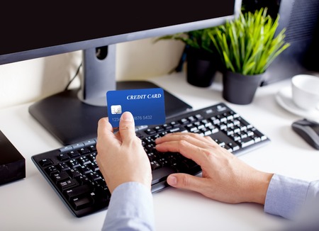 man makes the payment by credit card ,shopping onlineの写真素材