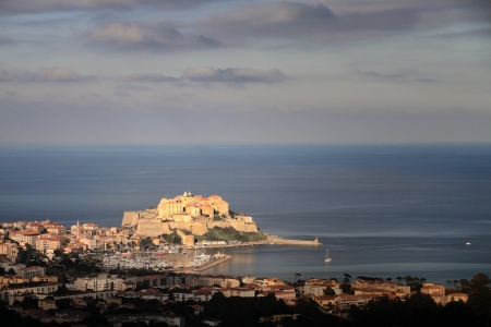 Port, harbour, town and citadel of Calvi in the Balagne region of Corsicaの写真素材