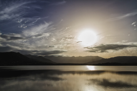 Sunset over Lac de Codole at Reginu in the Balagne region of Corsica with mountains in backgroundの写真素材