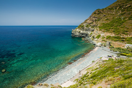 The beach and Genoese tower at Negru on the west coast of Cap Corse in Corsicaの写真素材