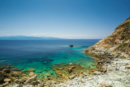 The coast of Cap Corse at Canelle in Corsica with the Desert des Agriates in the backgroundの写真素材