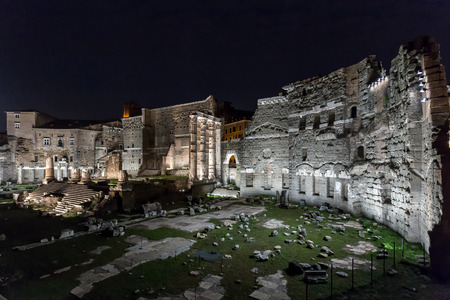 Roman ruins of Foro di Augusto in italy's capital city of Rome at nightの写真素材