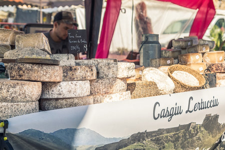 L'Ile Rousse, Corsica - 30th September 2018. Local cheeses are displayed for sale at an artisan fair in L'Ile Rousse in the Balagne region of Corsicaのeditorial素材