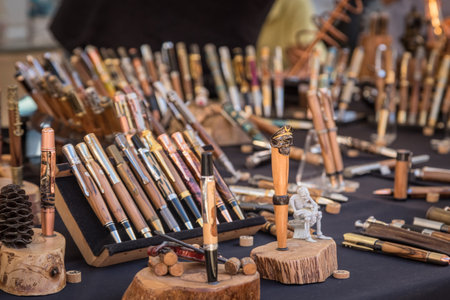 L'Ile Rousse, Corsica - 30th September 2018. Hand made wooden pens are displayed for sale at an artisan fair in L'Ile Rousse in the Balagne region of Corsicaのeditorial素材