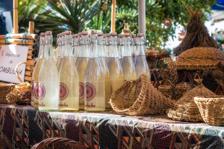 L'Ile Rousse, Corsica - 30th September 2018. Artisanal Kombucha tea and wicker baskets are displayed for sale at an artisan fair in L'Ile Rousse in the Balagen region of Corsicaのeditorial素材