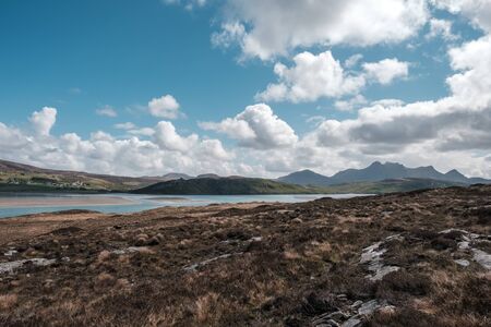 Castle Bharrich stands on a distant hill overlooking the Kyle of Tongue in Caithness on the north coast of Scotlandの写真素材