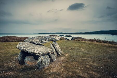 Neolithic wedge tomb at Altar overlooking Toormore Bay in County Corkon the south west coast of Irelandの写真素材