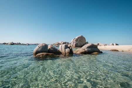 Large granite boulders on the coast of Cavallo Island n the Lavezzi archipelago of Corsica