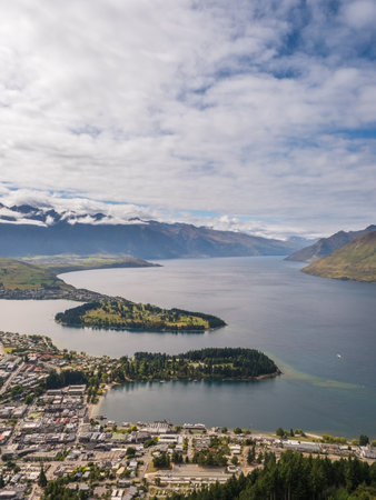 View over Queenstown and Lake Wakatipu on the South Island of New Zealand with the Remarkables mountains in the distanceの写真素材