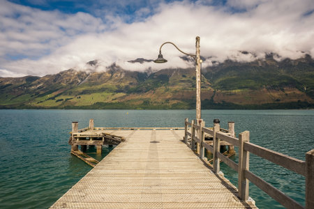 The wooden jetty at Glenorchy on Lake Wakatipu in New Zealand used for the transport of goods by steamship to and from Queenstownの写真素材