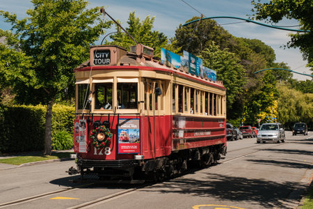 Christchurch, New Zealand - December 25th 2022: A heritage tram passes by on a tour of the city. Trams have been running in the city since 1882 and was reopened in 1995のeditorial素材