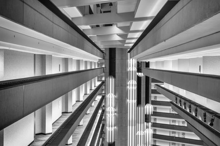 San Francisco, USA - December 30th 2022: Black and white image of lift pods travelling up and down the central atrium at the Hyatt Regency Hotel at Embarcardo in San Francisco, USAのeditorial素材