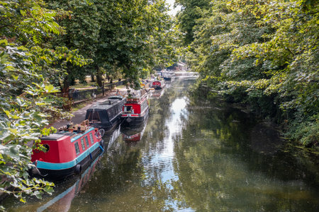 Regent's Canal, Victoria Park, Hackney, London, England - 29th July 2023: Narrow boats moored along the Regent's Canal near Victoria Park in Hackney, Londonのeditorial素材