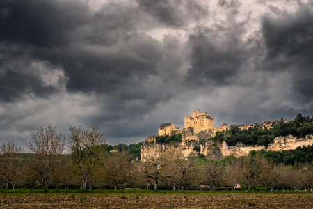 Beynac-et-Cazenac, France - 6th May 2024: Dark stormy skies over Chateau de Beynac in the Dordogne region of Franceのeditorial素材
