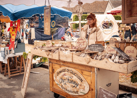 Nabirat, Nouvelle-Aquitaine, France - 12th May 2024: A vendor selling charcuterie at the annual strawberry fair, Foire de la Fraise, at Nabirat in the Dordogne region of Franceのeditorial素材