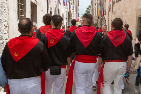 GUBBIO, ITALY - MAY 15 2016 - Supporters of Saint Antonio on their way to the Piazza Grande to watch and celebrate the annual Festa dei Ceri.のeditorial素材