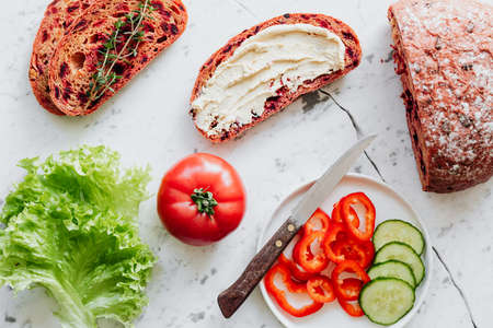 bread and vegetable on the tableの写真素材