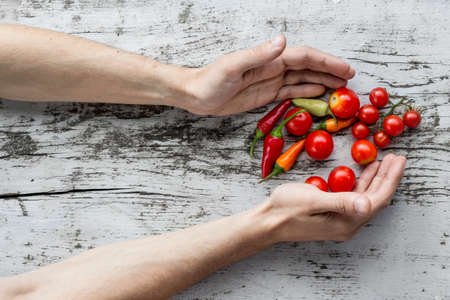 Hands and Rustic Vegetables Food Backgroundの写真素材