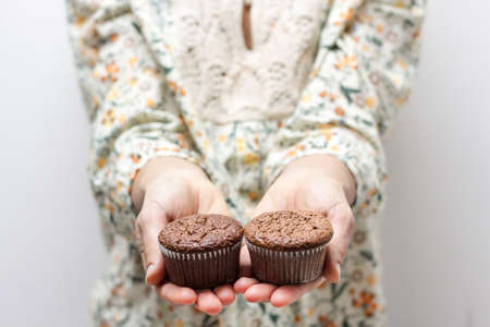 Delicious Woman Holding Cakes Food Backgroundの写真素材