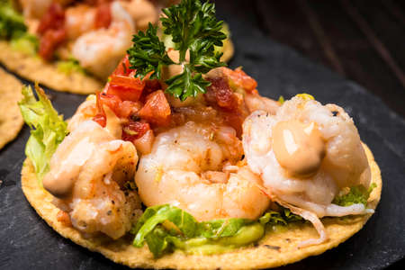 Hard shell Taco with shrimp and salsaの写真素材