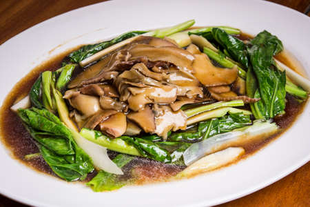 stir fried kale with mushrooms and oyster sauceの写真素材