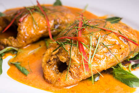 Thai style fried mackerel in red curry sauceの写真素材