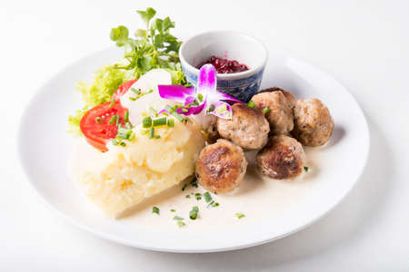 Swedish meatballs with mash potato and lingonberry sauceの写真素材