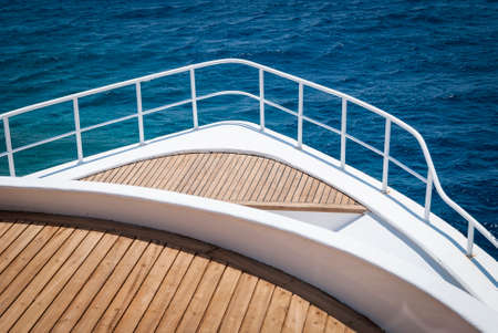 dive boat in the Red sea with blue ocean and wood deckの写真素材
