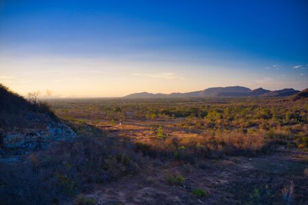 This unique photo shows the hilly landscape, from hua hin thailand, taken with a drone by the evening sun during a wonderful sunset!の写真素材