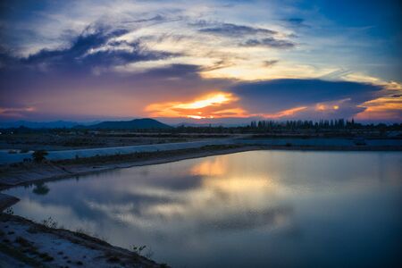 This unique photo shows the hilly landscape with lakes, from hua Hin in thailand, taken with a drone during a fantastic sunset!の写真素材