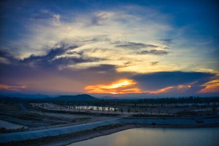 This unique photo shows the hilly landscape with lakes, from hua Hin in thailand, taken with a drone during a fantastic sunset!の写真素材
