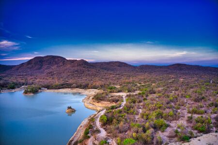 This unique photo shows the hilly landscape with lakes, from hua hin thailand, taken with a drone during a fantastic sunset!の写真素材
