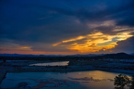 This unique photo shows the hilly landscape with lakes, from hua Hin in thailand, taken with a drone during a fantastic sunset!の写真素材