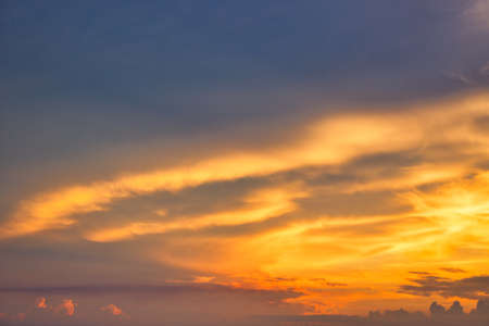 This unique photo shows a fiery red sunset sky with a cloud structure. The picture was taken in Hua Hin Thailand!の写真素材