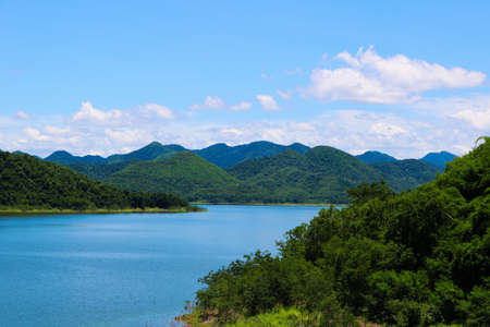 This unique picture shows the beautiful nature with hills and trees and the great reservoir in the Kaeng Krachan National Park in Thailandの写真素材