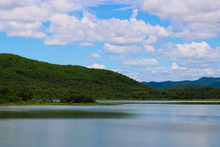 This unique picture shows the beautiful nature with hills and trees and the great reservoir in the Kaeng Krachan National Park in Thailandの写真素材