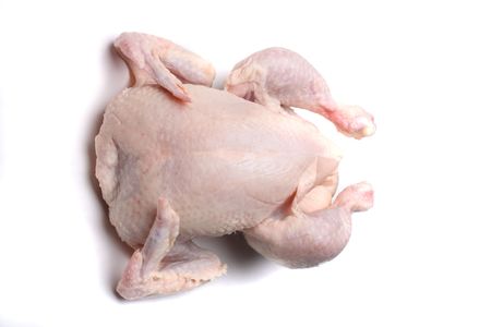 pink raw chicken on the white backgroundの写真素材