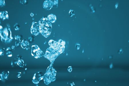 drops of water in the air in the blue color 