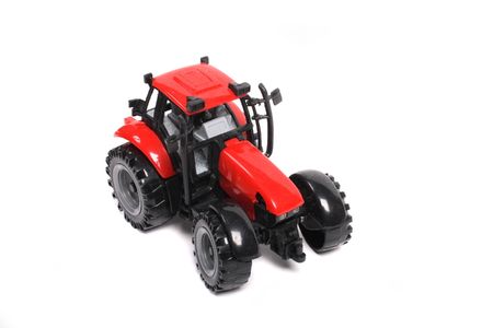 red tractor toy on the white backgroundの写真素材