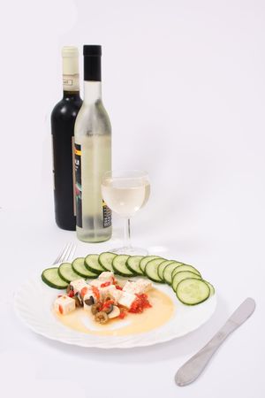 cheese with vegetable and the bottles of wineの写真素材