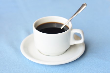 cup of cofee on the blue background の写真素材