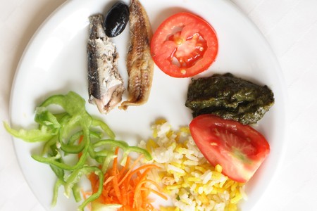 gourmet food with fruits vegetables and fishesの写真素材