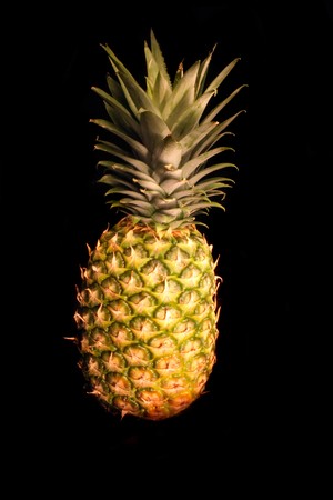 big fresh pineapple on the black backgroundの写真素材