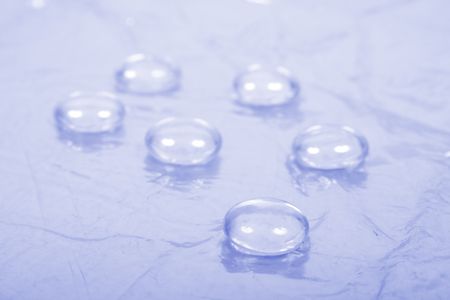 six water drops on the blue background
