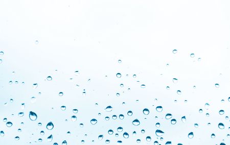 blue water drops on the white backgroundの写真素材