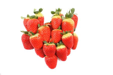 heart from the red strawberries on the white background の写真素材