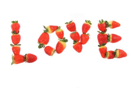 love from the red strawberries on the white backgroundの写真素材
