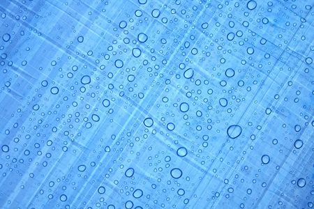 water drops background in the blue color の写真素材