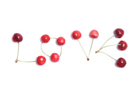 word love from the cherries on the white backgroundの写真素材
